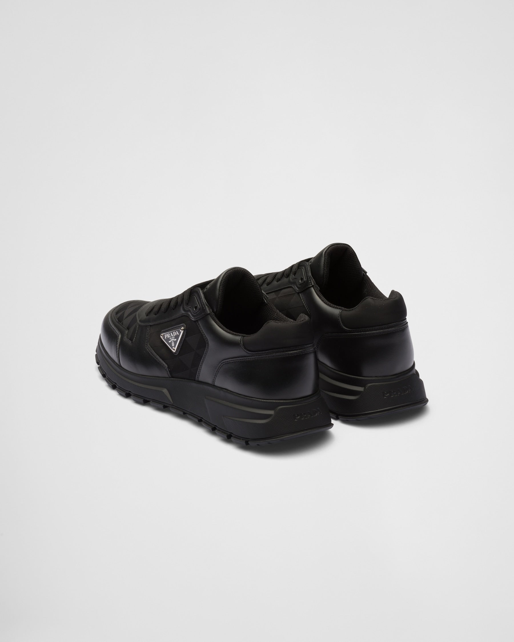 Prada montantes en cuir et Re-Nylon